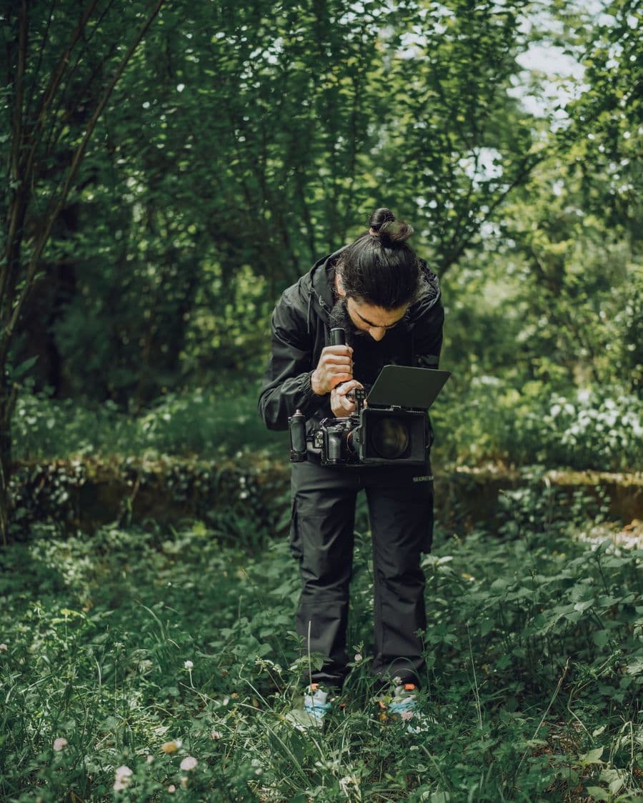 Illustration: a videographer operating a cinema camera outdoors