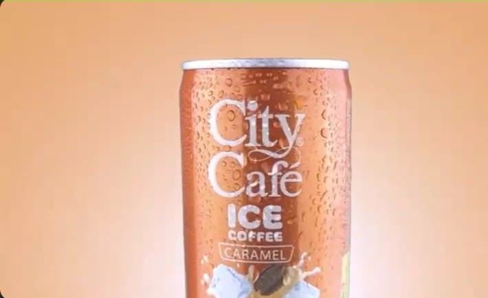A chilled City Cafe cup, beaded with condensation, shot for an advert.
